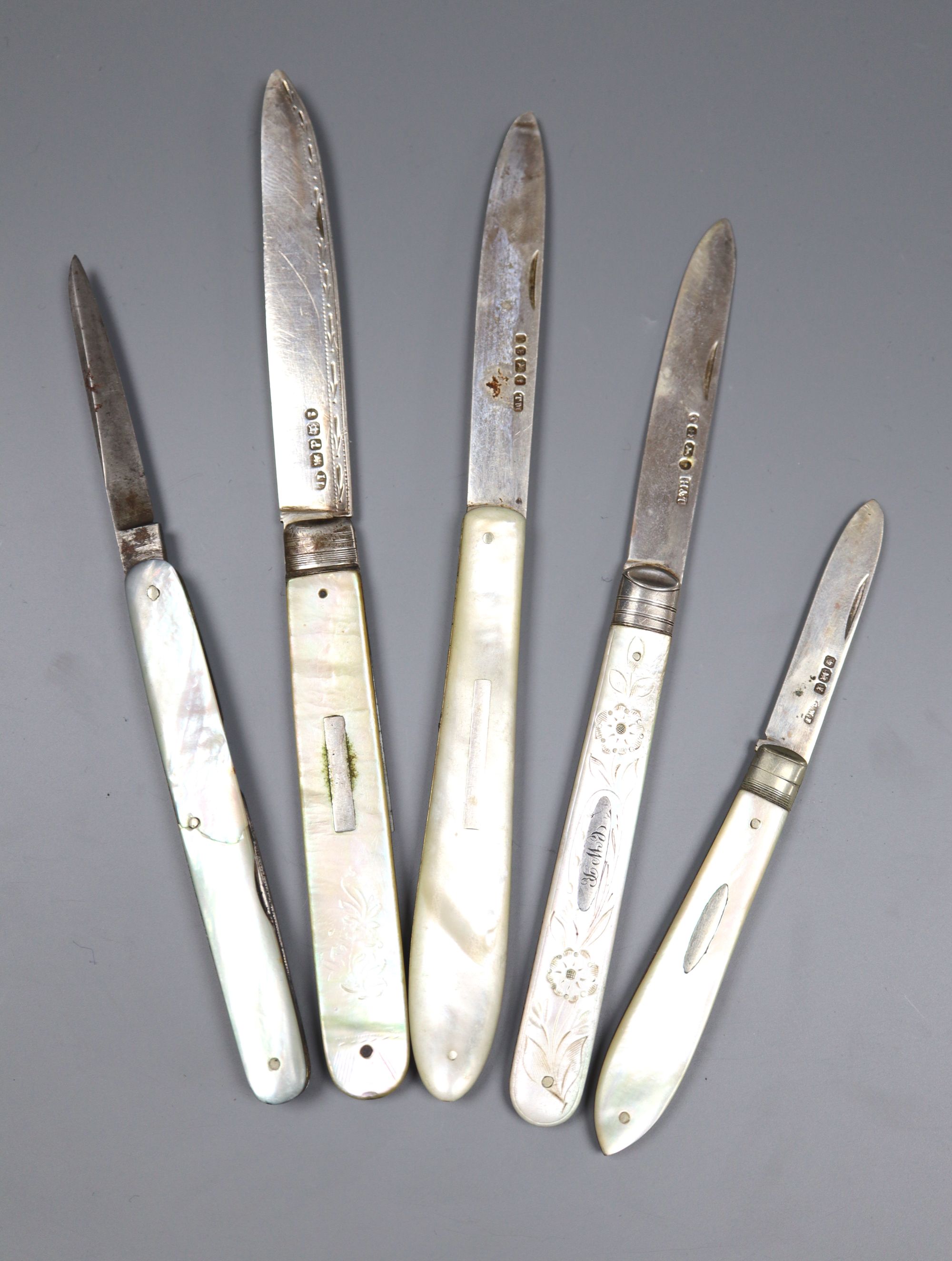 Four assorted Victorian and later silver and mother of pearl fruit knives and one other penknife